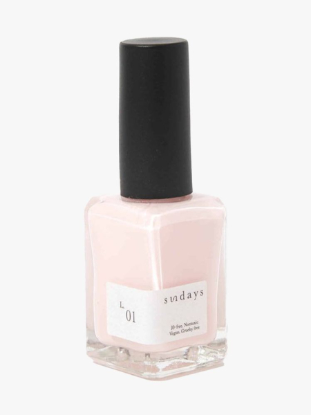 Sundays Nail Polish in L.01 bottle of light pink nail polish with black cap on light gray background